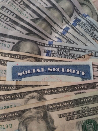 line of cash with a social security card