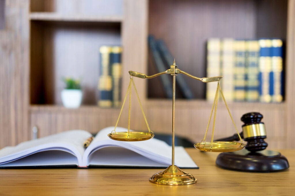 scale of justice on table with gavel