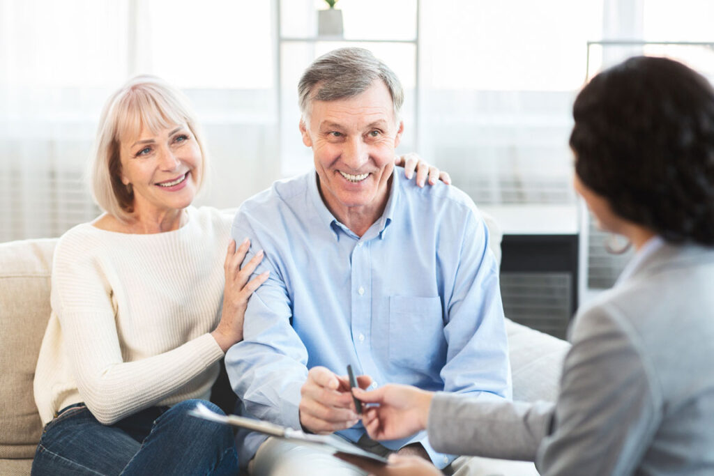 older couple speaking with financial advisor
