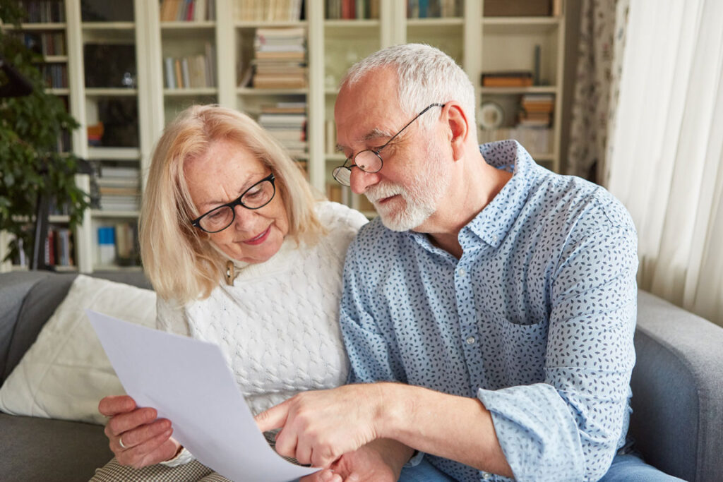 married senior couple looking over Power of Attorney documents